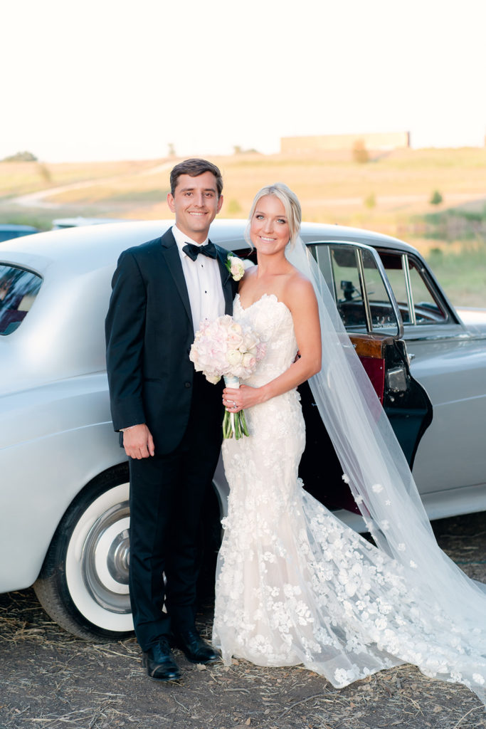 bride and groom portrait with Rolls Royce 
